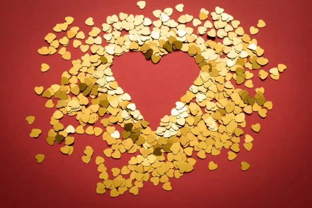 golden heart on a red background