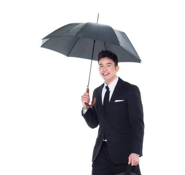 istock Handsome businessman holding an umbrella 1086387106