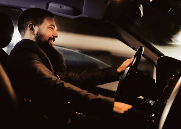istock Male driver ride a car during evening traffic jam 1086389744