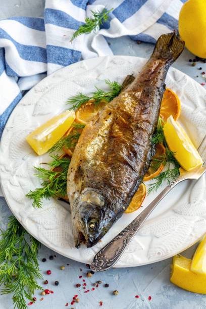 istock Baked lake trout with lemon and dill. 1086393082