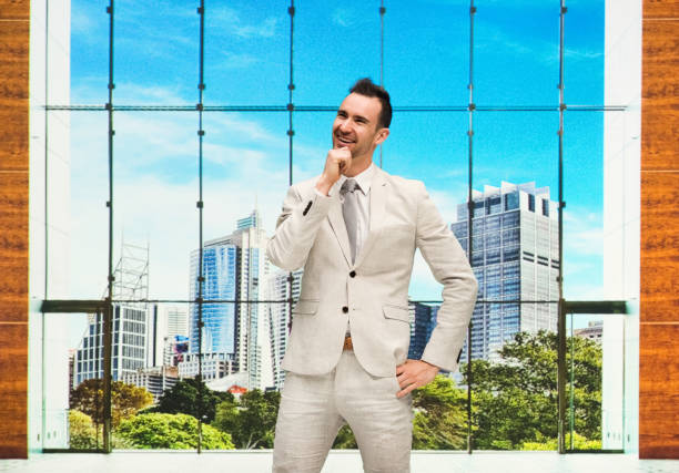 istock Handsome businessman standing at work and feeling happy 1086397458