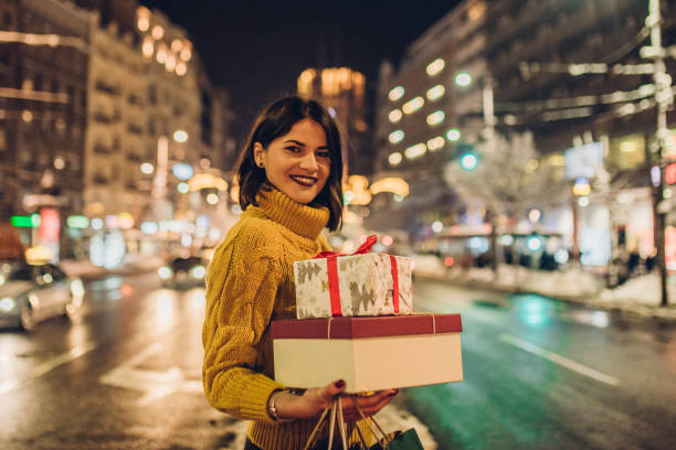 istock Girl holding gifts 1086402618