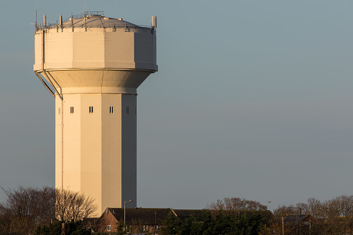 Water tower. Massive water pressure storage building Caister Norfolk UK. 1920s built structure used for water supply. Unique architecture.