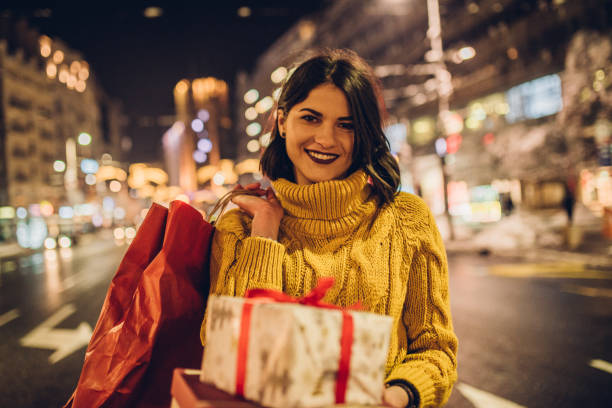 istock Joyful woman holding presents 1086403122