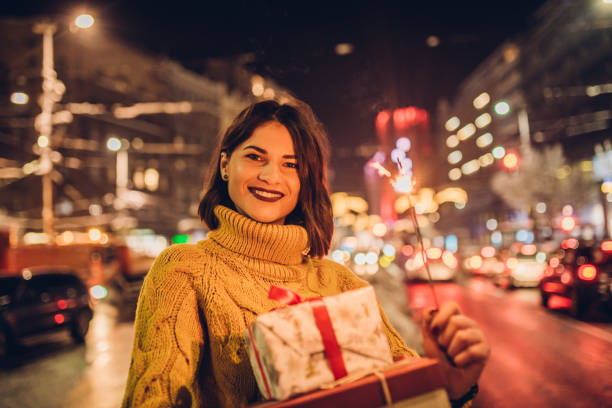 istock Young woman holding gifts 1086404486