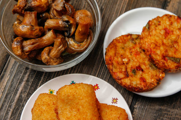 istock Fried fish filet, veggie burger and grilled champignons 1086404920