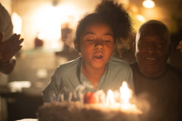 istock Granddaughter Celebrating Birthday Party 1086406490