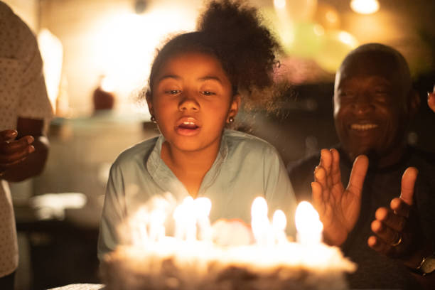 istock Granddaughter Celebrating Birthday Party 1086406504