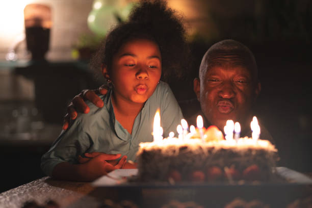 istock Granddaughter Celebrating Birthday Party 1086406520