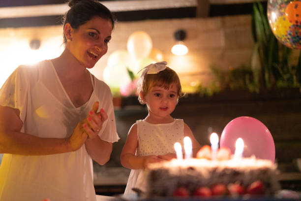 istock Child Celebrating Her Birthday Party at Home 1086406534