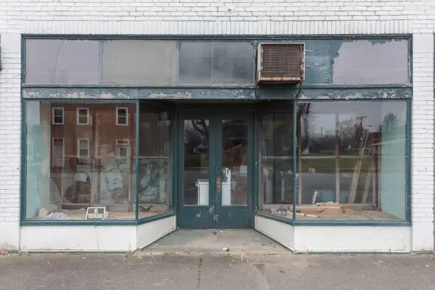 Photo of Large window storefront with green and white paint