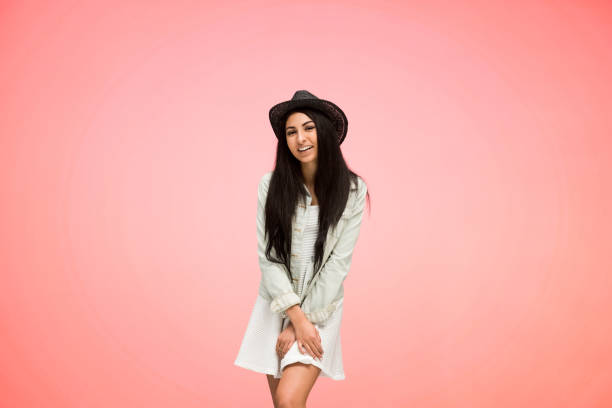 istock Beautiful female on pink background is looking trendy 1086413562