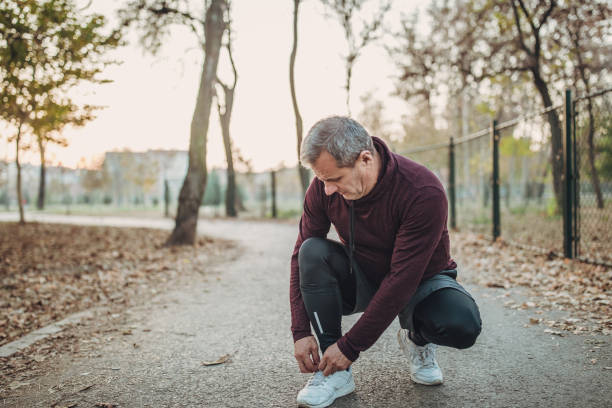 istock Senior man tying shoelace 1086426530