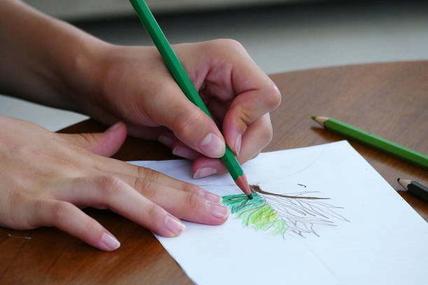 istock a child draws a picture on the desk, 1086426690