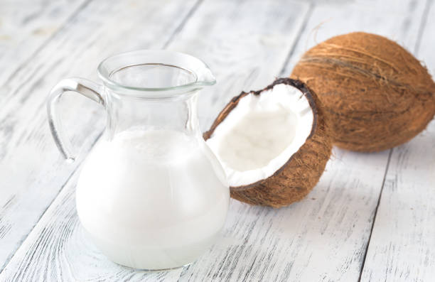istock Jug of coconut milk with fresh coconut 1086426872