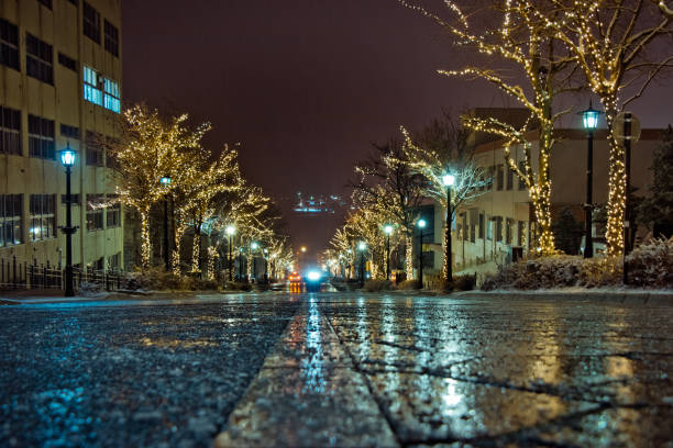 istock Snow is falling, Christmas Street tree night light and illumination view on trees, see the yacht from top hill on road direct to Hakodate Harbor at Motomachi Area, Hokkaido, Japan. 1086431834