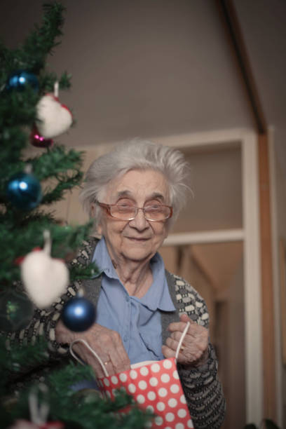 istock Female pensioner enjoying in Christmas. 1086433422
