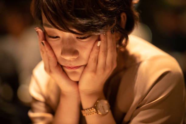 istock Young woman thinking in bar 1086438120