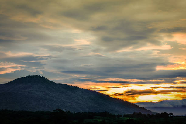 istock Dramatic of sunset after the mountain with rain clouds golden 1086441656