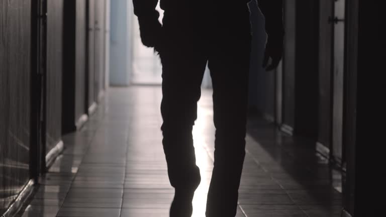 Silhouette of Man Going with Handgun