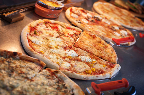istock Slice of pizza quattro stagioni on scapula 1086446086