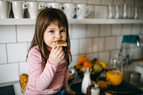 istock Girl eating hazelnut cream 1086447358