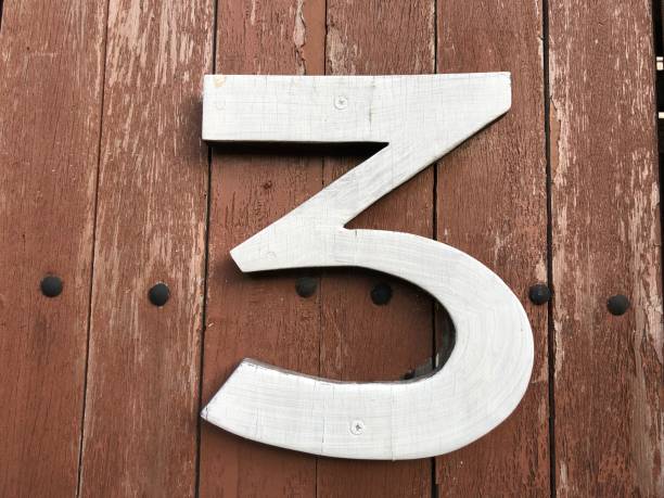 istock Number 3 with wood background 1086449490