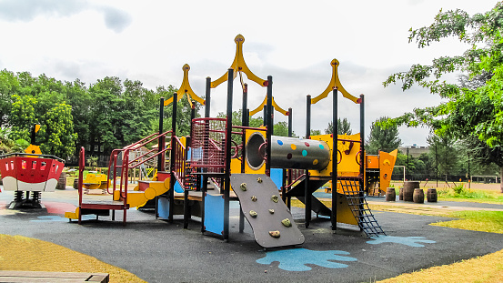 Outdoor Playground for Kids in Public Park with Lot of Playing Equipment