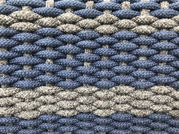 istock woven grey and dark blue small tight cotton rolls as a pattern of wicker 1086483402