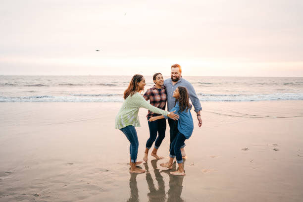 istock Sunset at the beach with family 1086492012
