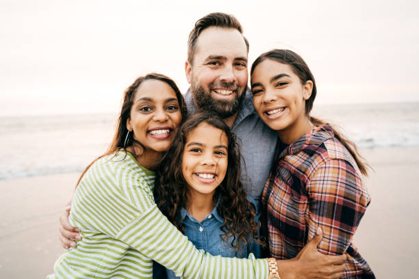 istock Smiling parents with two children 1086492024