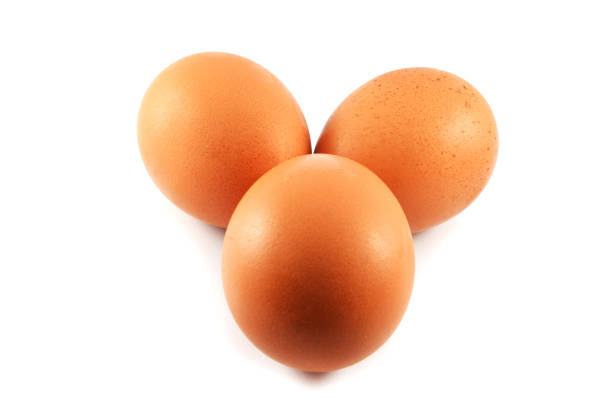istock fresh eggs three / egg brown from the farm isolated on white background 1086511888