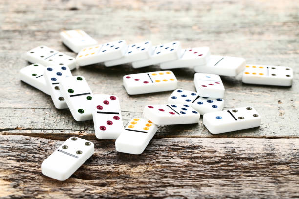 istock Dominoes on gray wooden table 1086521154