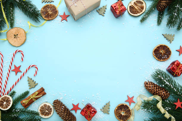 istock Christmas decorations with dry fruits and candy canes on blue background 1086521466