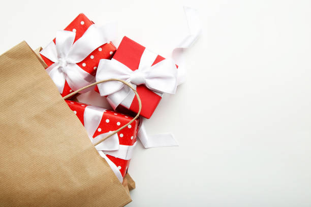 istock Shopping bag with gift boxes on gray background 1086522968