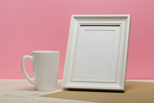 istock white frame with mug on white desk near pink wall 1086532724