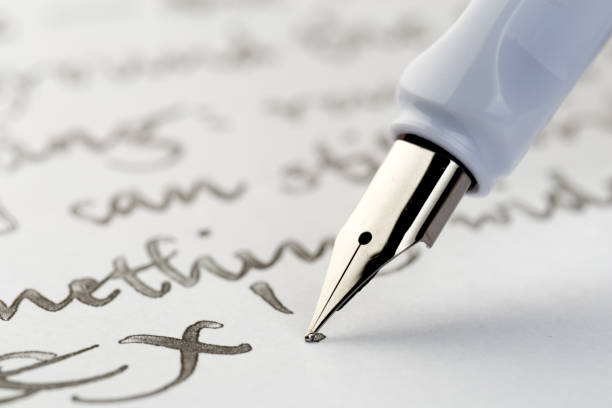 istock white fountain pen writing a letter 1086532886