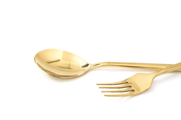 istock golden spoon and fork isolated on a white background 1086535932