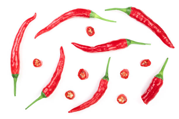 istock sliced red hot chili pepper isolated on white background. Top view. Flat lay pattern 1086537096