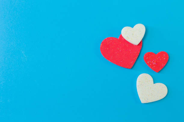 istock heart on blue background close up image. 1086537354