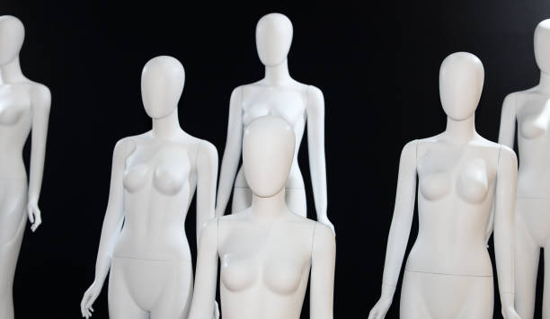 istock White Naked Mannequin over black background 1086539456