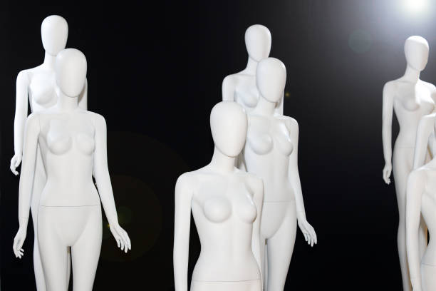 istock White Naked Mannequin over black background 1086539466