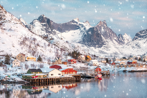 Colorful scandinavian village on coastline in snowing day at Reine, Lofoten islands, Norway