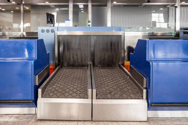 istock Luggage x-ray scanner conveyor belt of security at immigration checkpoint 1086544780