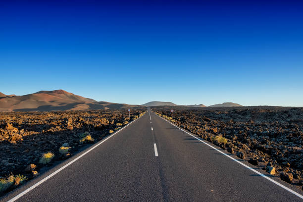istock Road timanfaya volcano lanzarote long 1086547548