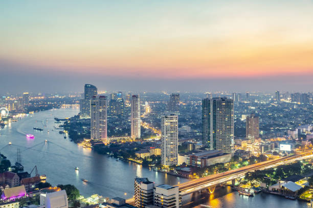 istock High angle view urban cityscape skyline at sunset with crowded tall buildings and river 1086549508