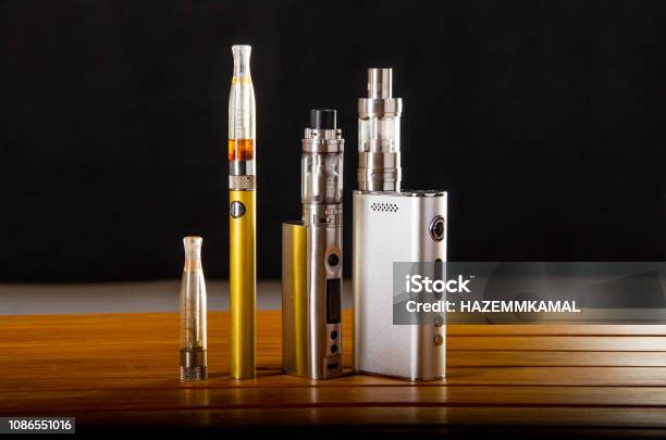 Vape Devices And Electronic Cigarette Ecig And Mods Over A Black Background Stock Photo - Download Image Now