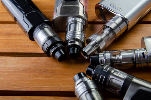 istock vape devices and electronic cigarette, ecig and mods background. 1086551036