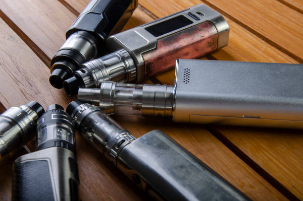 istock vape devices and electronic cigarette, ecig and mods background. 1086551056