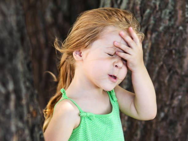 Cute girl facepalming forgetting something Cute little curly hair blonde girl facepalming forgetting something facepalm stock pictures, royalty-free photos & images